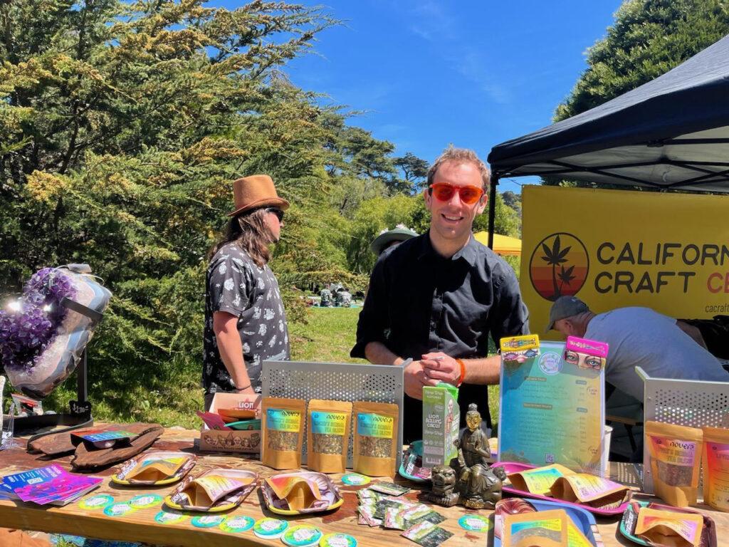 Maximizing flavour with Ganjier Alex - at a booth at an outdoor cannabis event.