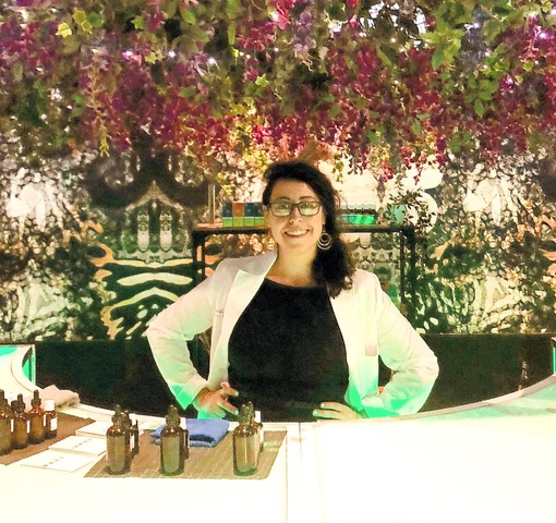 amanda breeze behind a counter ready to prepare cannabis infused topicals