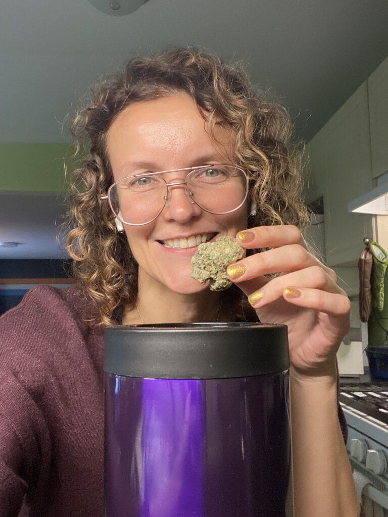 marge holding a nug of weed above an open ardent fx