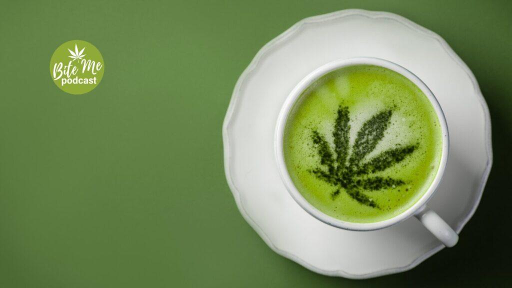 A top down view of a cup of lemon matcha latte with a cannabis leaf on the top