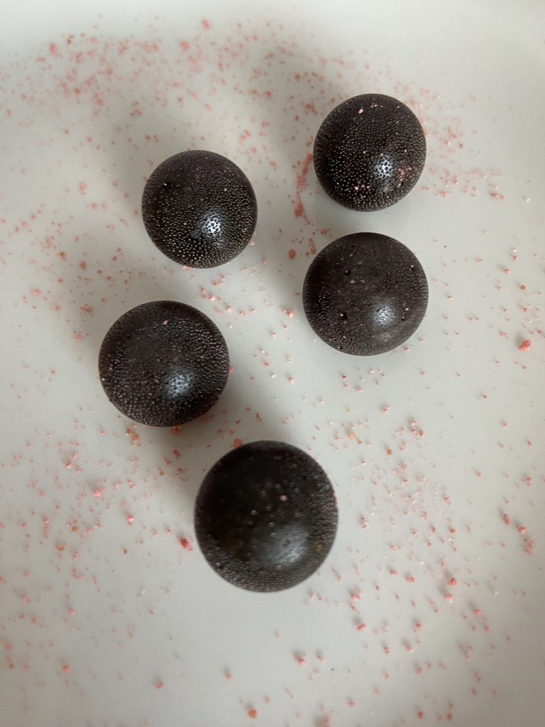 a close up image of 5 hard candies for the sour yuzu drop challenge.