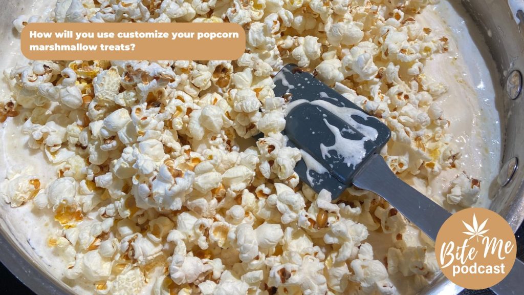 image of popcorn in a pan with the melted butter and marshmallows for the popcorn marshmallow treats