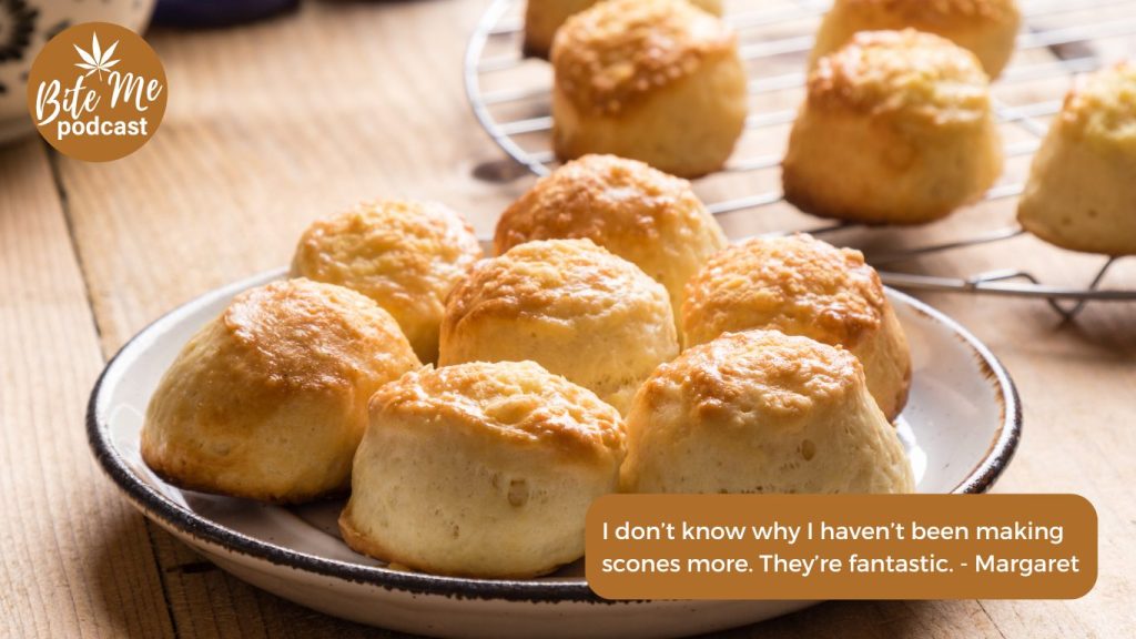 a plate of cannabis infused scones with a scones sitting on a a cooling rack in the background.