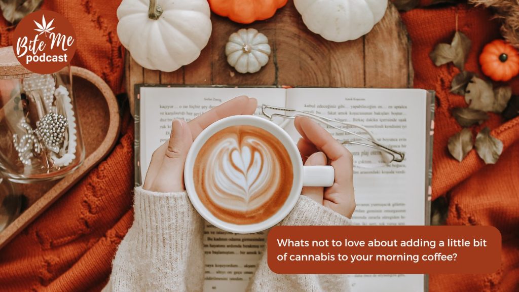 top shot of a cup of coffee with creamer over an open book and surrounded by fall decorations for the infused pumpkin spice creamer episode