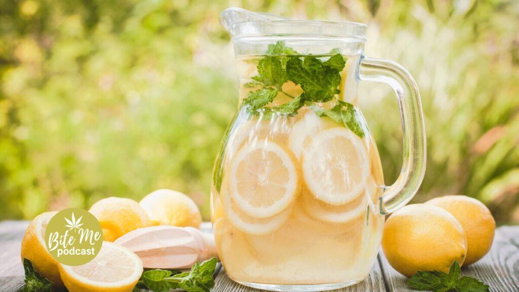 image of a jug of lemonade surrounded by whole lemons for the lit lemonade recipe